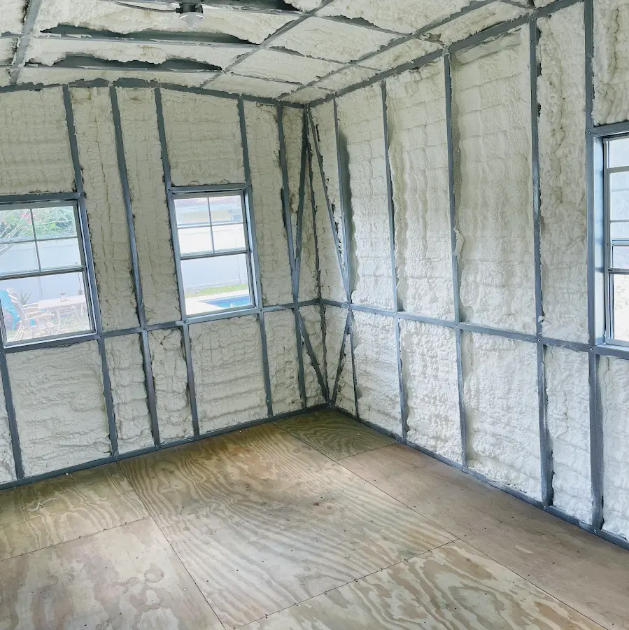 Closed-cell spray foam insulation applied to wall cavities in a residential project in Brevard